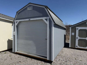 A179 Roll Up door on Lofted Barn 10x16 Grey Shadow with Barn White Trim - no permit required