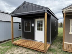 B284: Front Porch on Utility Shed 10x20 Black with Peppercorn Trim - a permit is easy