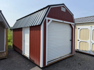 A305 Roll Up door on Lofted Barn 10x16 Rustic Red with White Trim and Black roof - no permit required SOLD